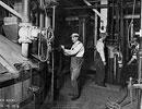 Workers showing controls of mash tubs