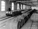 Workers with butyl in steel drums ready to be shipped