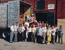 Employees gather in front of Rack House I